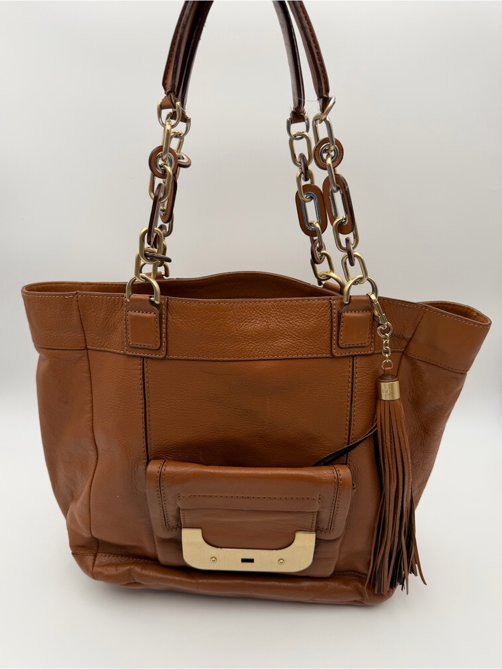 Brown Leather Tote Bag with Chain Handles & Tassel Accent
